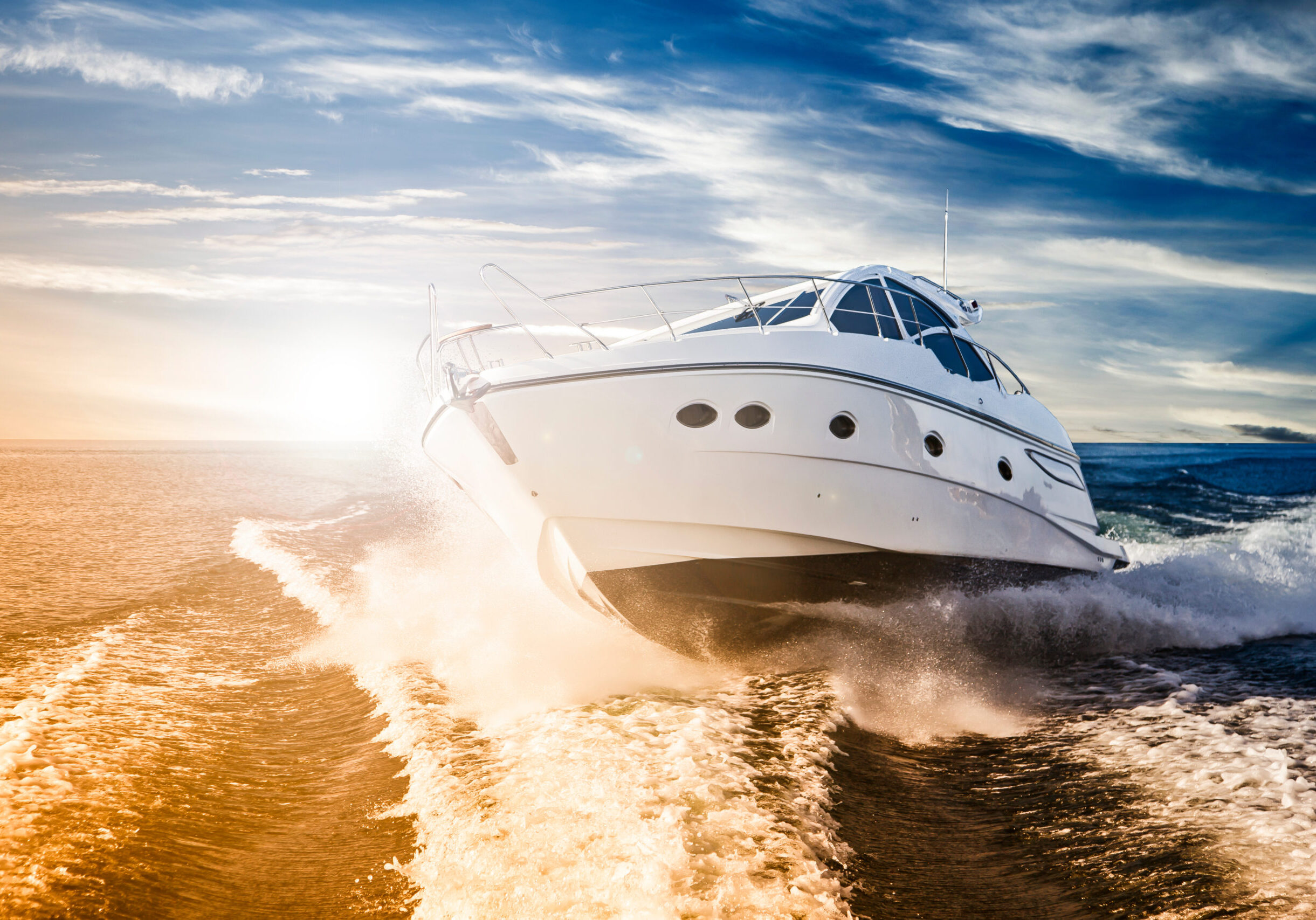 Luxurious motor boat sailing the sea at dawn